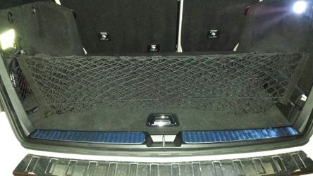 Trunk cargo nets with envelop middle