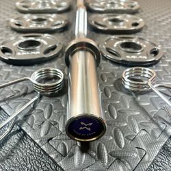 Olympic Equipment: Brand NEW Curl Bar of 20# with Cooper Bearings and Plates 2X25s, 2X10s, 2X5 and 2X2.5s pounds. Brute 105#