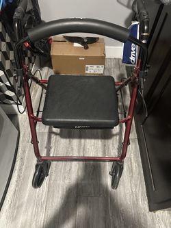 Walker with seat by new drive