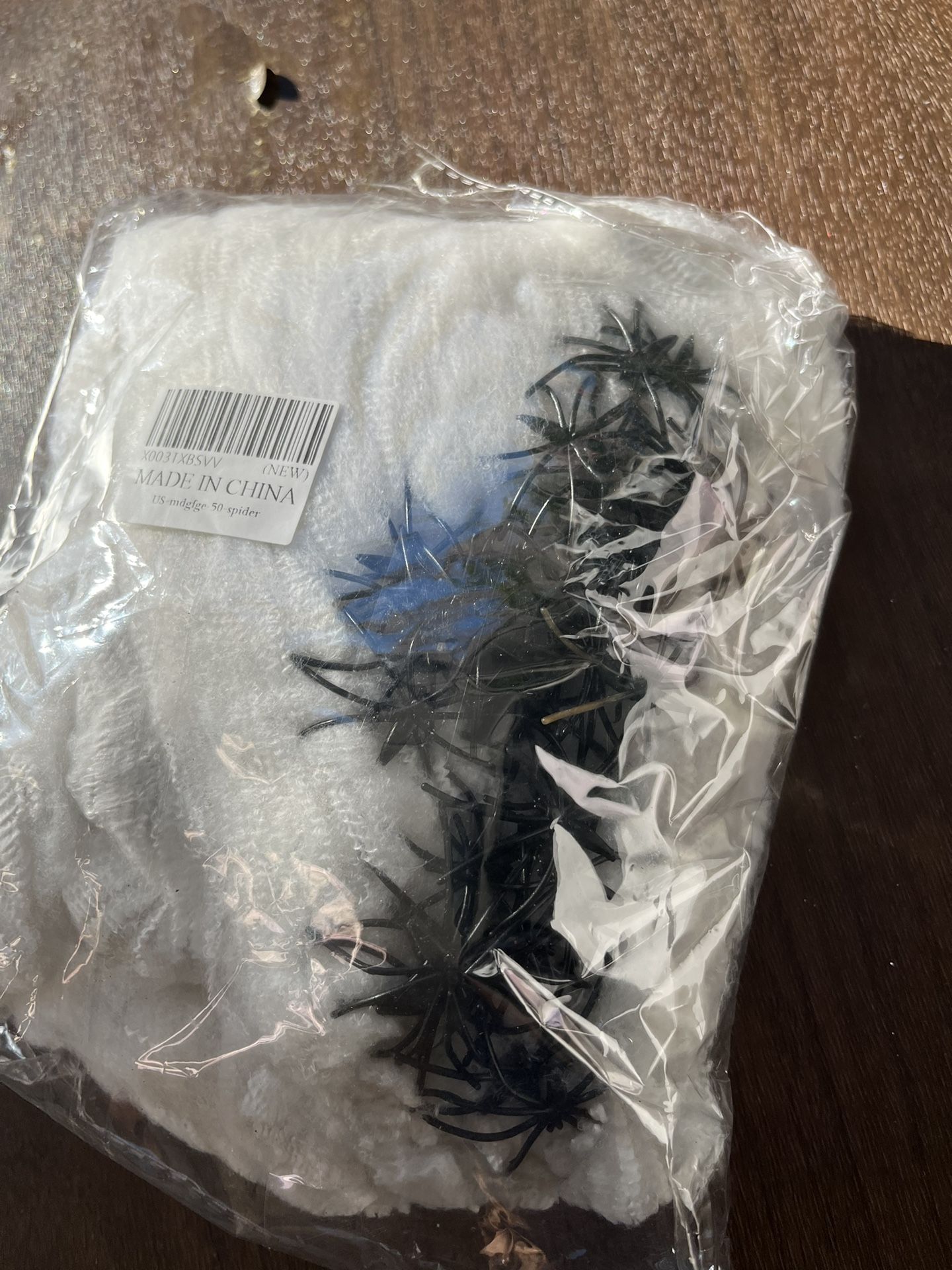 Cloth spider web and 50 spiders