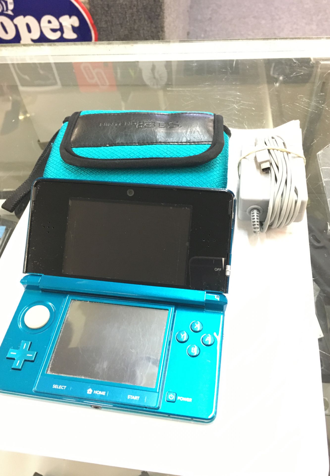 Nintendo 3DS with charger and case