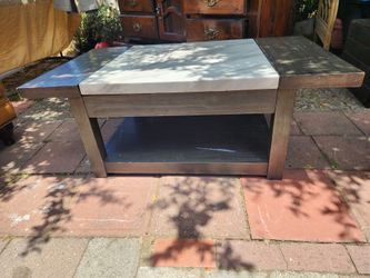 Coffee table with hidden storage
