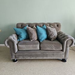 Dark Gray Tufted Loveseat with Gunmetal Nailhead Trim — $250 (Pickup Only)
