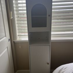 Cabinet: Standalone cabinet with shelves