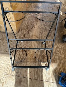 plant caddy or metal plant stand with wheels, /             carrito portamacetas o estante metálico para plantas con ruedas,
