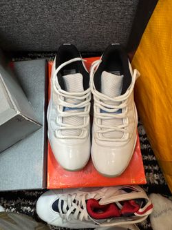 Nike Air Jordan 11 Retro Low 'Legend Blue' sneakers featuring a white patent leather