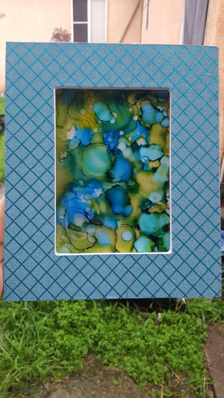 Abstract art in blue frame. Green