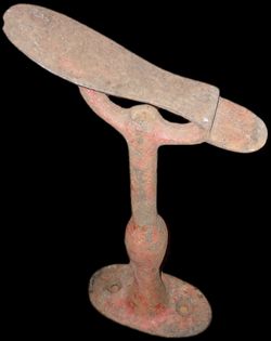 Old faded red Shoe Last Stand cast iron