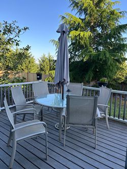 Outdoor table with chairs and umbrella