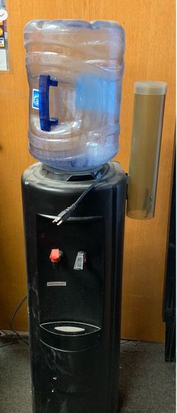 Electric water dispenser - serves hot or cold water - has been in storage and needs a little cleaning