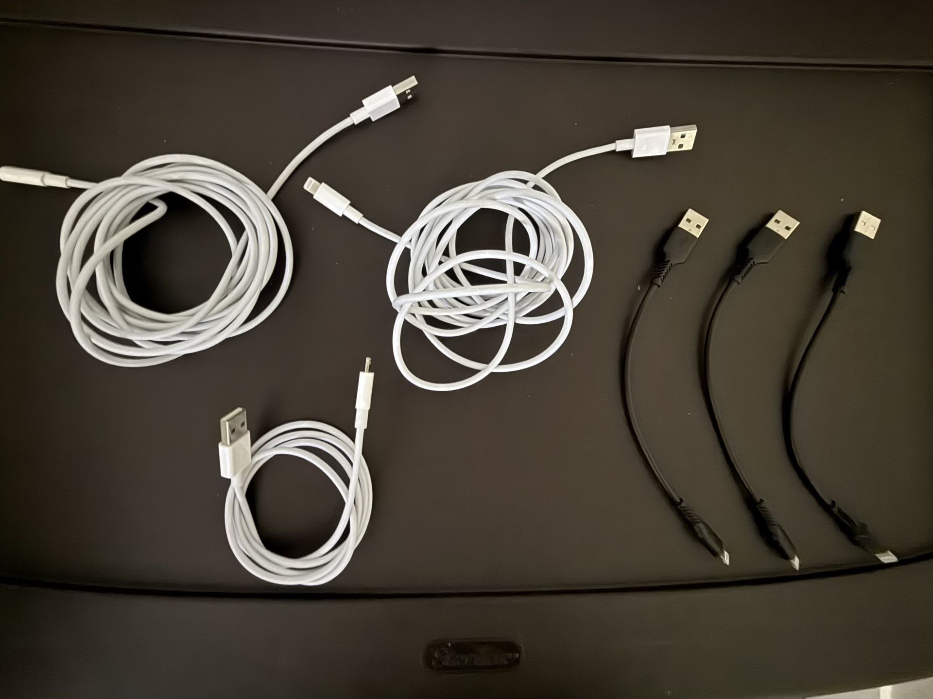 Lot Of Lightning iPhone Charger Power Cords. There Are two 10 foot cords, one 3 foot cord and three 8 inch cords. Will sell individually or as a set.