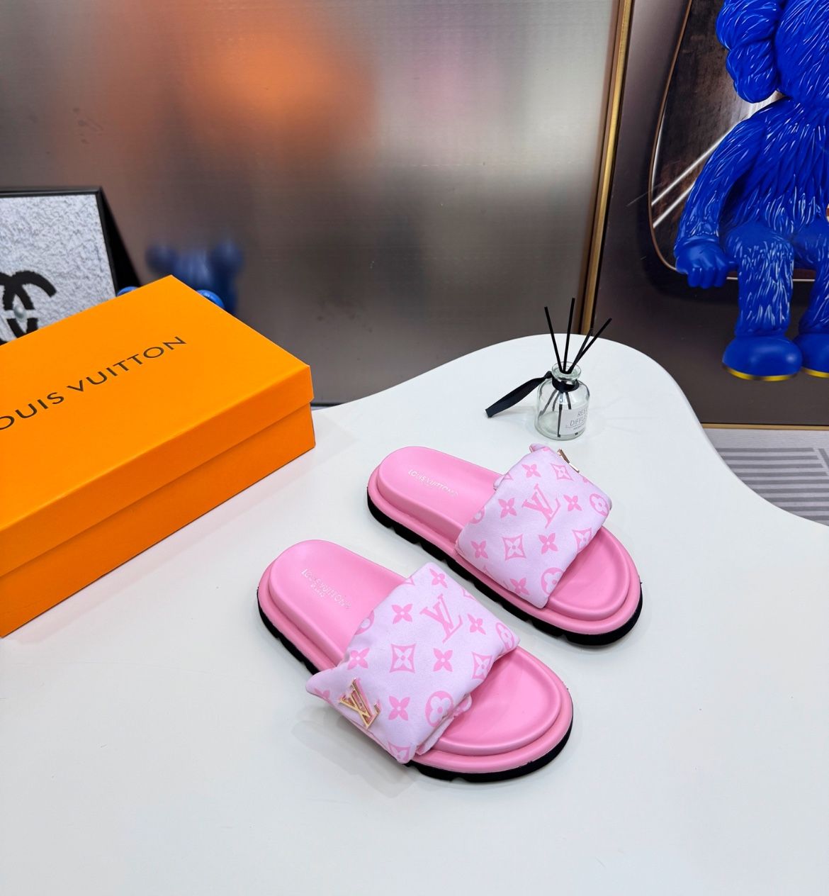Woman’s pink Louis Vuitton Slides