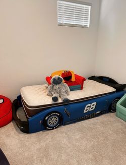 Kids car bed like brand new never slept on