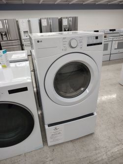 $598 and $209 LG 7.4 cu Ft gas dryer with sensor dry on a laundry pedestal