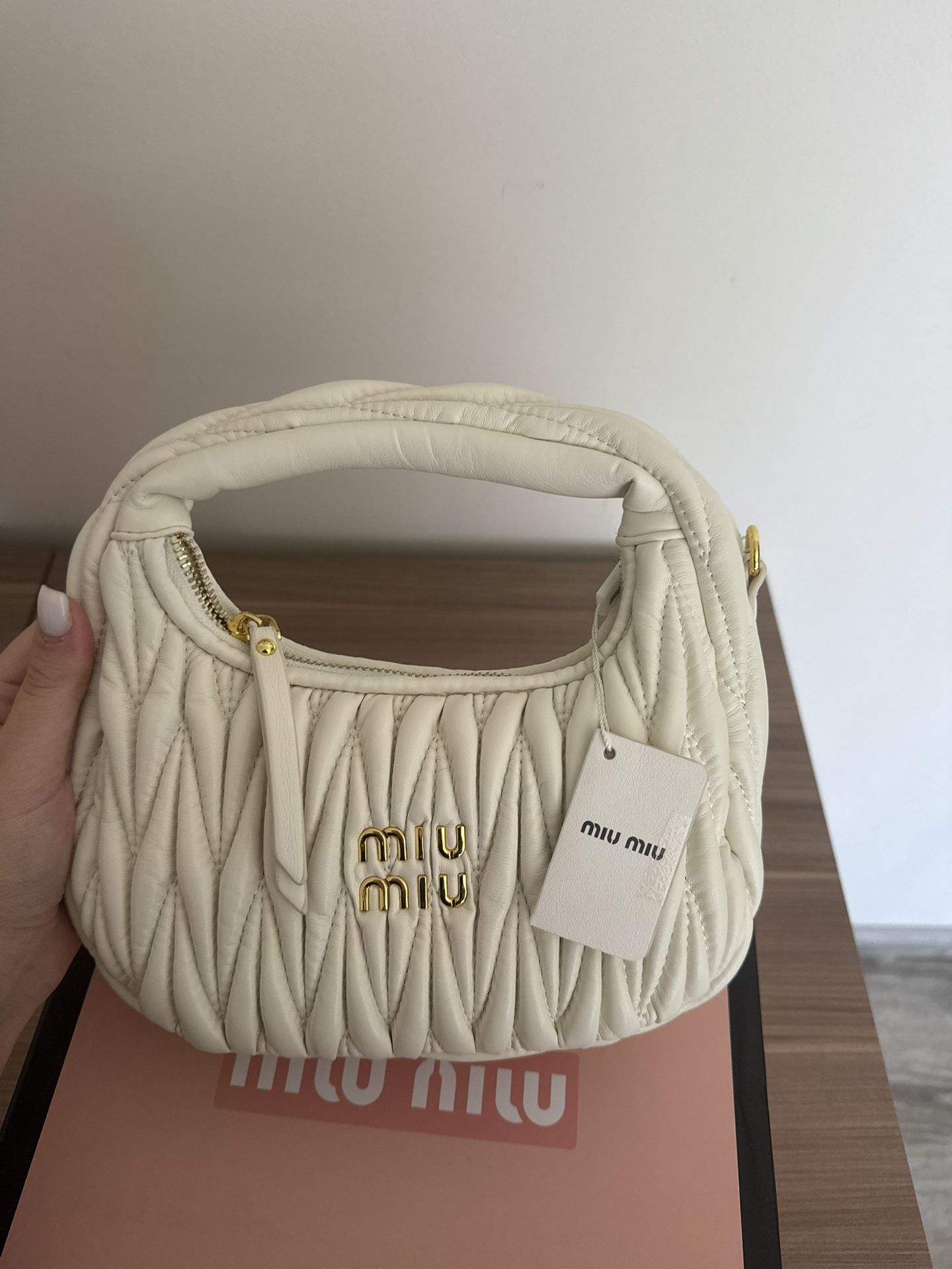 Mui Mui: A chic and versatile bag, perfect for adding a touch of understated elegance to any outfit.