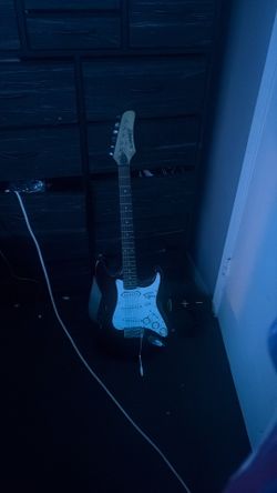 Whammer electric guitar including beautiful strap