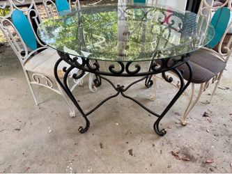 Vintage wrought iron table with glass top