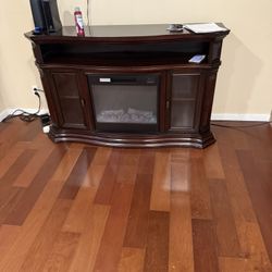 Dark Brown TV Stand With Fire Place Heater And Cabinet 