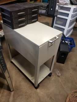 File cabinet with wheels and sliding back. Comes with 2 brown small 3 drawer stands. Make offer for all Thumbnail
