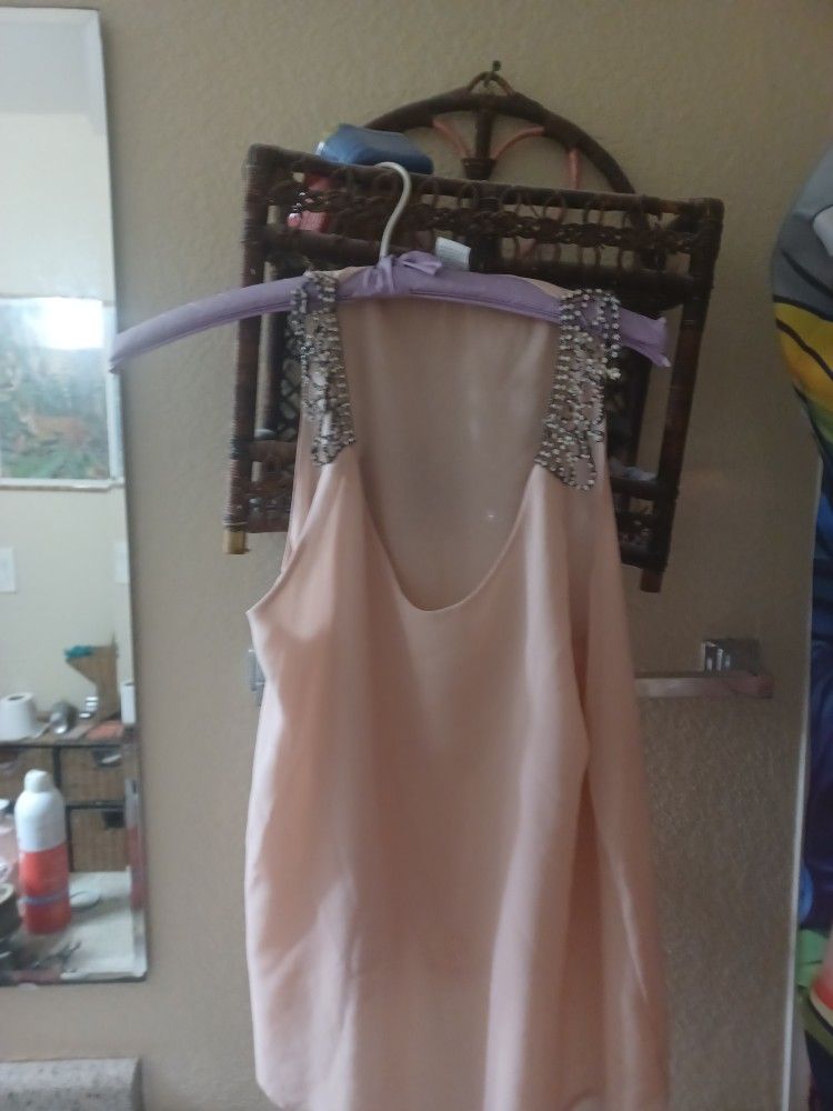 Pink tank top with Rhinestone straps.