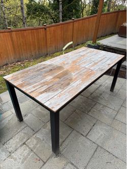 Wooden outdoor table with metal base