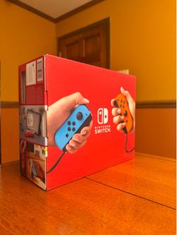 Nintendo Switch With Neon Blue And Neon Red Joy Con