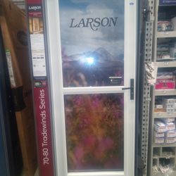 LARSON 32" STORM DOOR WHITE MODEL DOUGLAS (2) AVAILABLE FOR $180.00 EACH &(1) 32" BROWN FOR $180.00 NEW DOORS ON BOXES.