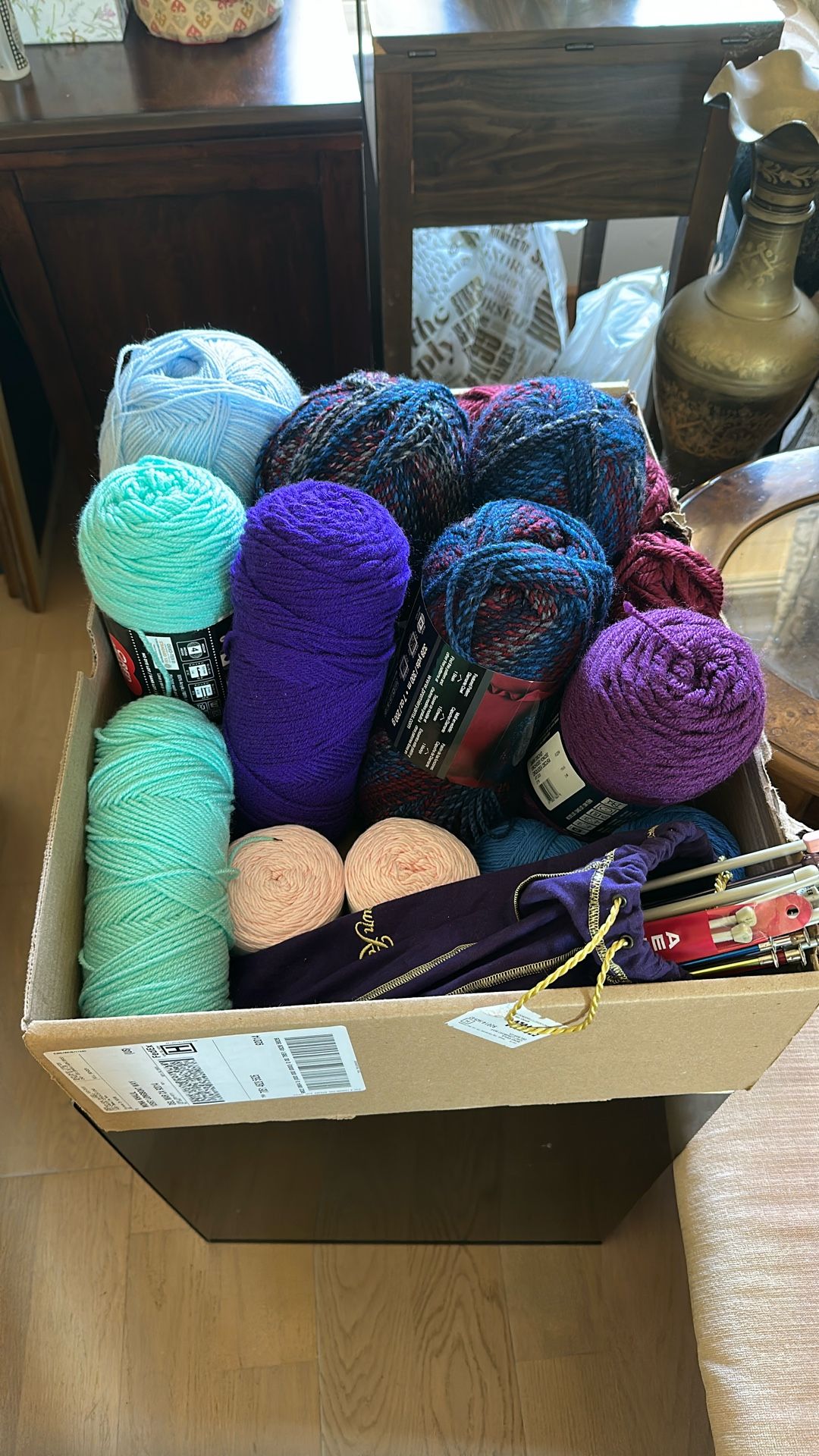 Box Of Yarn And Knitting Needles