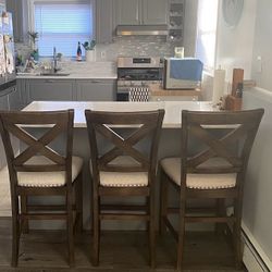 Three Moriville upholstered bar stools