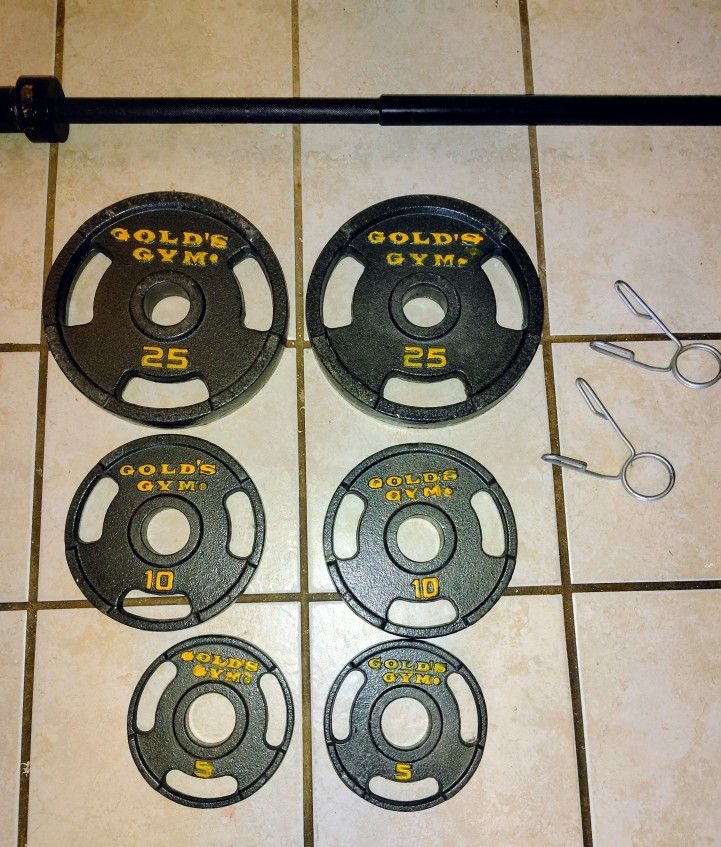 Used 7 ft. Olympic Barbell set Gold Gym Plates ( 120 pounds total weight with barbell)