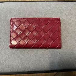 Red Estée Lauder three fold wallet with mirror