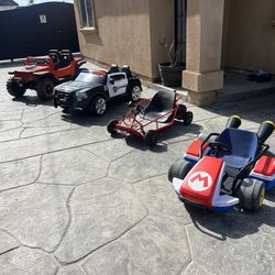 4 power wheels cars jeep 24v comes with charger super strong asking $200 / mario kart 24v comes with charger fast asking $200 / and Razor dube buggy s
