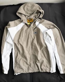 Corteiz windbreaker jacket in beige and white color blocking