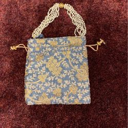 Silver gray gold drawstring bag with pearl handles