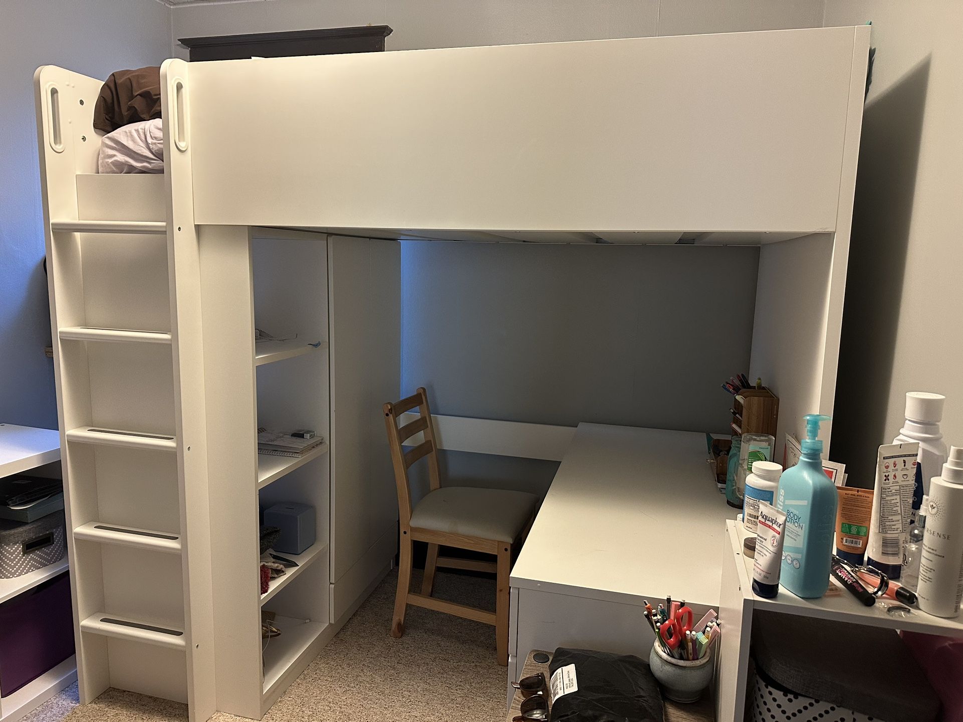 Ikea White twin bed frame with desk, closet, shelves, and ladder built in