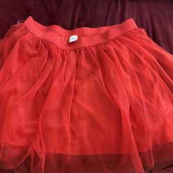 This is a red tulle tutu skirt with an elastic waistband from Halloween spirit!!! Great for costume!