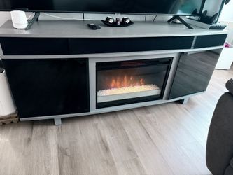 TV table with heated fireplace and speaker