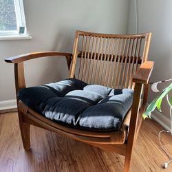 CB2 Noelie Rattan Lounge Chair With Black Cushion