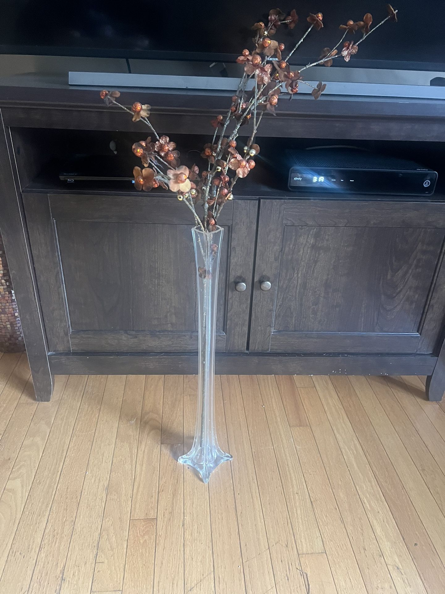 thin tall glass vase with orange brown flowers 35” tall p/u Jamison, PA