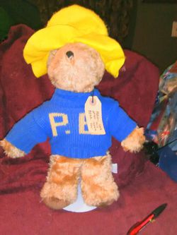 Paddington bear eden toys 1981 London england original tags woren but intact has been played with but still I'm fair shape 15 inches tall