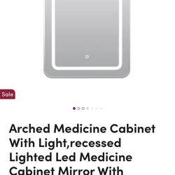 Modern arched medicine cabinet with built-in LED lighting. Recessed install for a clean, flush look.