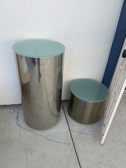 polished aluminum or chrome drum side table with a glass top, 