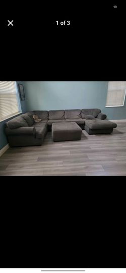 Dark green sectional sofa with ottoman