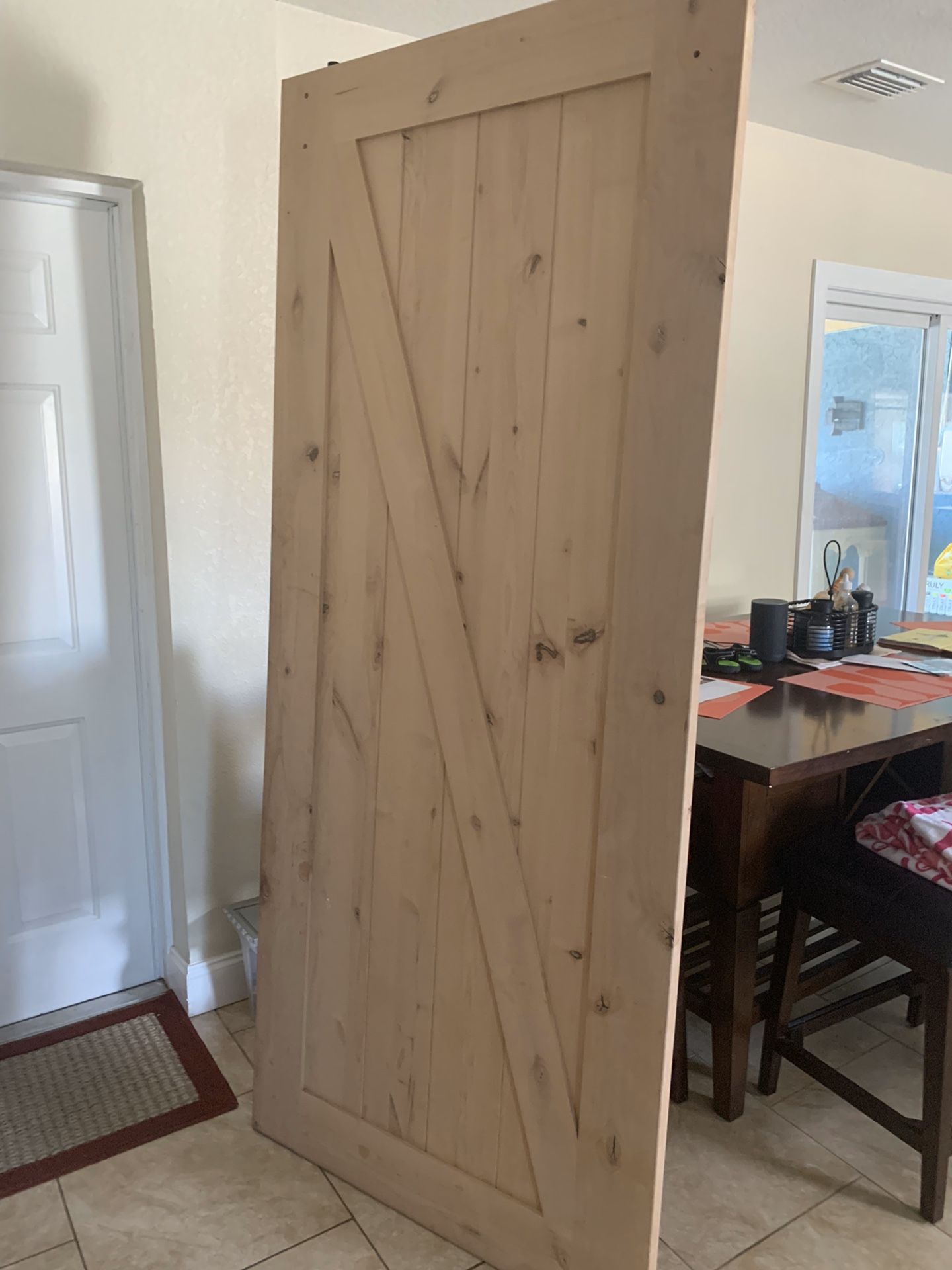 Solid wood barn door with installation kit included . 3feet wide by 6 feet long