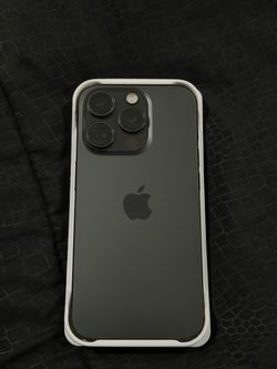 iPhone 15 Pro with charger