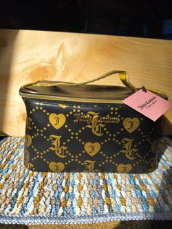 Women's black and gold Juicy Couture makeup cosmetic travel bag