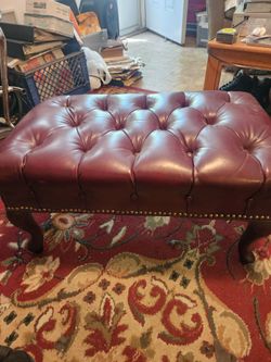 Vintage footstool  leather covering.