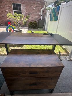 Electric standing desk with filing cabinet and drawer accesories