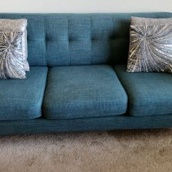 Teal Couch For Three With Cushions