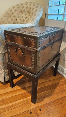 An antique brass-studded leather chest on stand(A pairs)